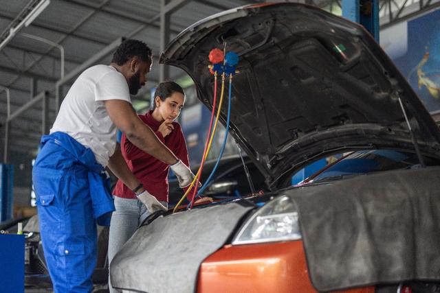 Emergency fuel delivery service showing technician delivering petrol or diesel to stranded motorist in the UK